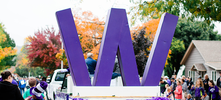 A truck drives the W Float at the WSU Homecoming Parade.