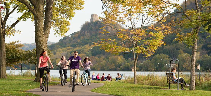 Students bike around Lake Winona.